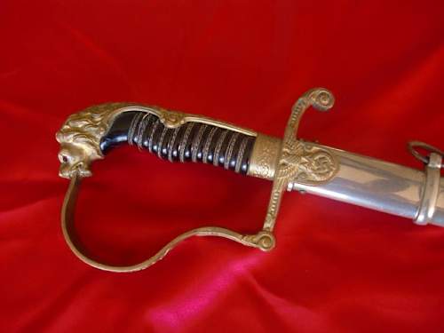 Lionhead Sword w/Nickel scabbard ?