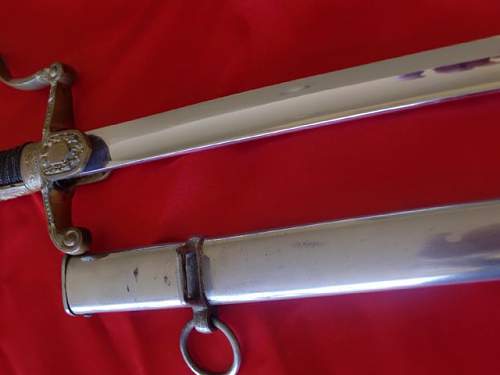 Lionhead Sword w/Nickel scabbard ?