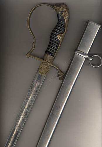Lionhead Sword w/Nickel scabbard ?