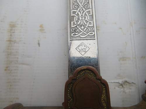 Engraved puma sword