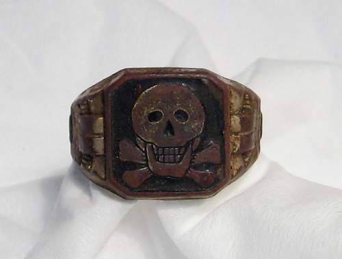 Totenkopf ring with leering skull in black enamel real or fake?