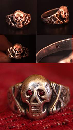 Skull ring with red eyes.