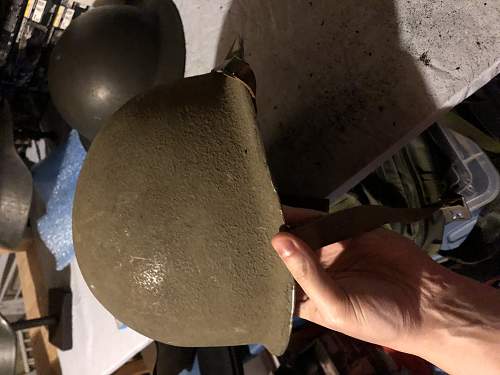 Early M1 helmet front seam fixed bail question