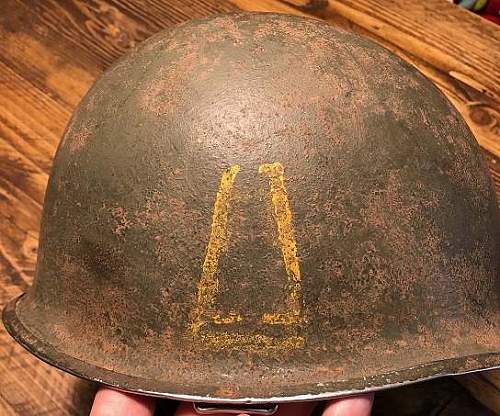 77th Division M1 Helmets.