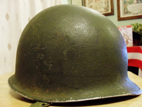 Fixed bail M-1 helmet, looks to have a gray painted band ?