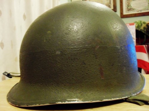 Fixed bail M-1 helmet, looks to have a gray painted band ?