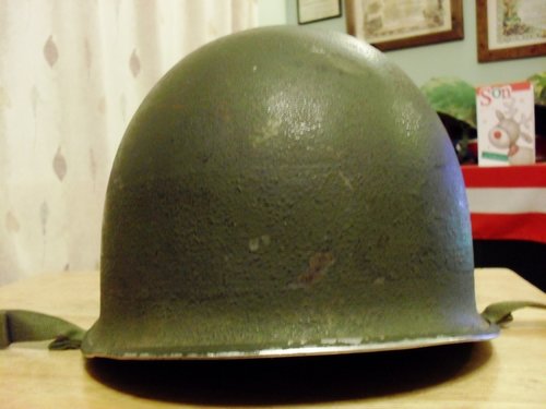 Fixed bail M-1 helmet, looks to have a gray painted band ?