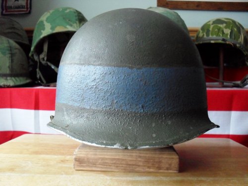 Fixed bail M-1 helmet, looks to have a gray painted band ?