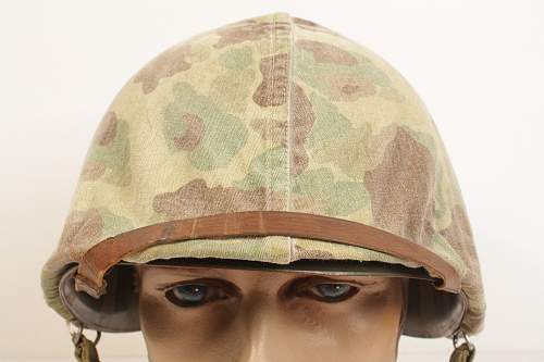 WWII M1 helmet w/ USMC cover.