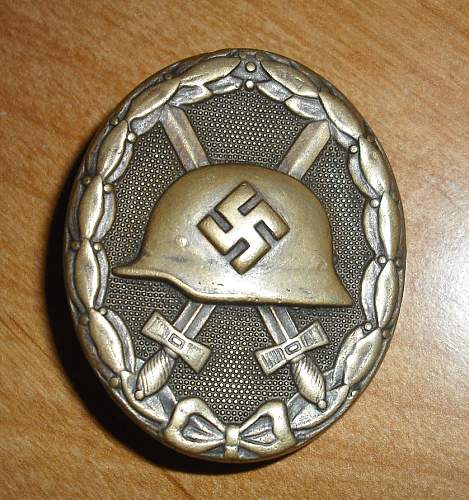 German Verwundetenabzeichen--silver Gold? and ??  Opinions please