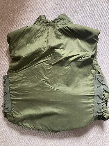 Does this look like a repro m69 flak vest with old labels on it?