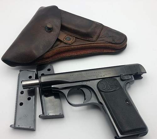 FN Model 1910 pistol with holster