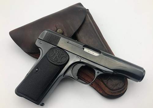 FN Model 1910 pistol with holster