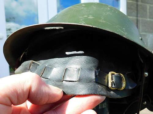 Romanian M73/80 steel helmet with parade badge.