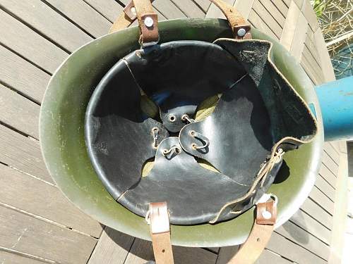 Romanian M73/80 steel helmet with parade badge.