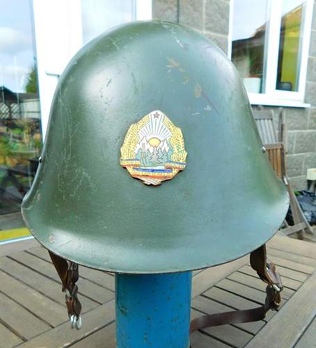 Romanian M73/80 steel helmet with parade badge.