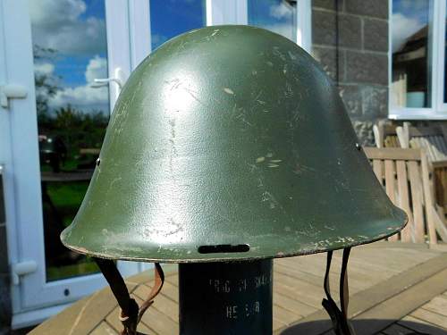 Romanian M73/80 steel helmet with parade badge.