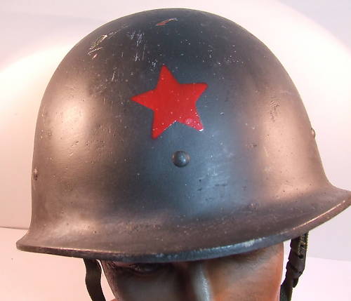 unusual fiber type helmet with red star?