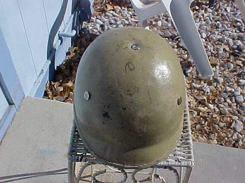 very crude M1 style helmet with Polish Wz50 liner , possibly an IRAQI helmet?