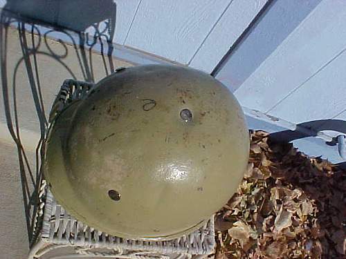 very crude M1 style helmet with Polish Wz50 liner , possibly an IRAQI helmet?