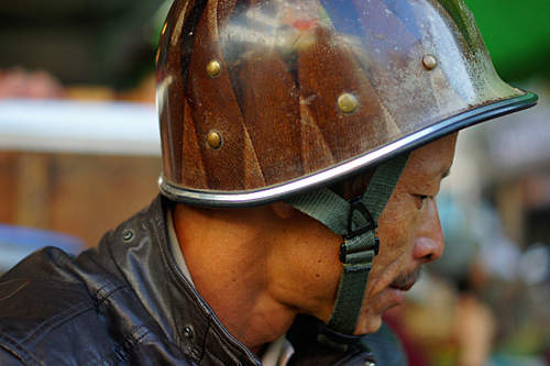 unusual M1 helmet liner modified for motorcyclist in Vietnam