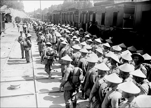 British soldier wearing a French IndoChinese sun hat on armistice day 1918