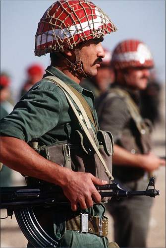 SYRIAN soldier with unknown eastern european style helmet with leather Y straps
