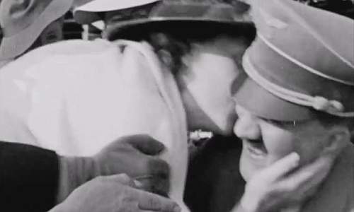 Hitler gets kissed by an American woman at 1936 Olympics