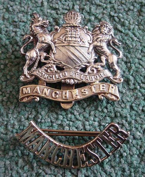 Manchester Regt cap badge and shoulder title